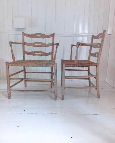 A pair of late 18th Century Thames Valley japanned 'Cottage' armchairs