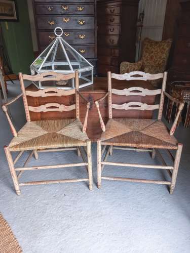 A pair of late 18th Century Thames Valley japanned 'Cottage' armchairs