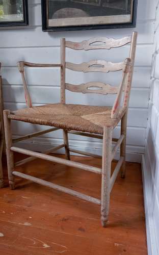 A pair of late 18th Century Thames Valley japanned 'Cottage' armchairs