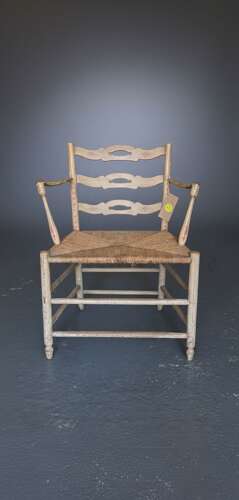 A pair of late 18th Century Thames Valley japanned 'Cottage' armchairs