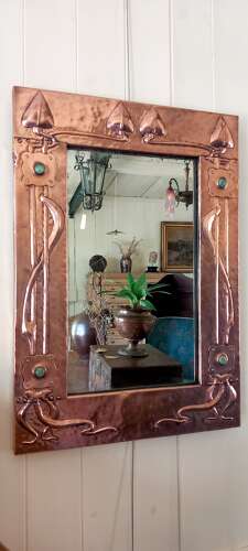 An Arts&Crafts/Art Nouveau period copper framed mirror in the manner of Liberty&Co