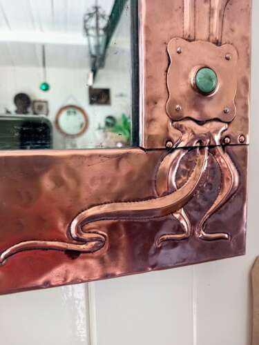 An Arts&Crafts/Art Nouveau period copper framed mirror in the manner of Liberty&Co