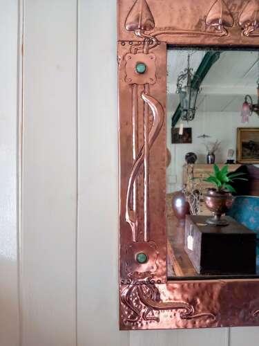 An Arts&Crafts/Art Nouveau period copper framed mirror in the manner of Liberty&Co