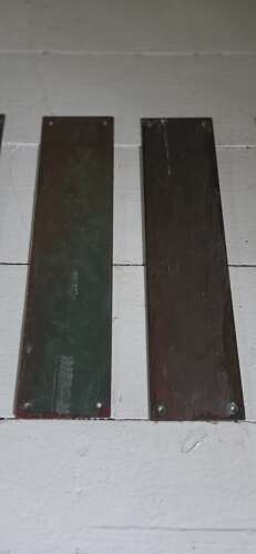 Early 20th century pair of patinated Brass door Fingerplates