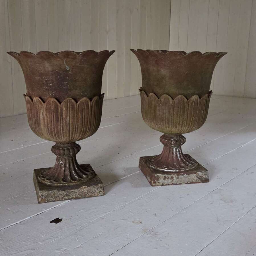 A pair of Andrew Handyside cast iron Lotus pattern garden Urns c1860