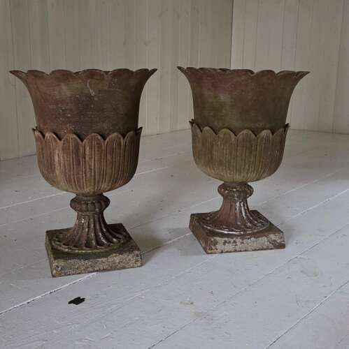 A pair of Andrew Handyside cast iron Lotus pattern garden Urns c1860