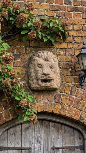 An early antique Irish carved Granite Lion Mask Spout